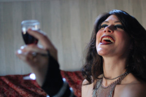 The Evil Queen toasts her conquered enemy, drinking her finest wine in celebration...